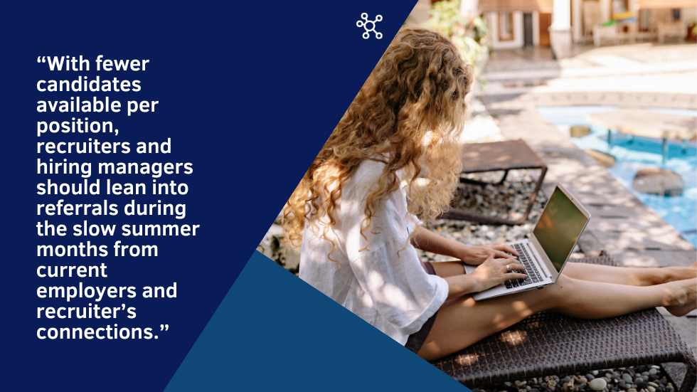 Woman on laptop on lawn chair nearby a pool